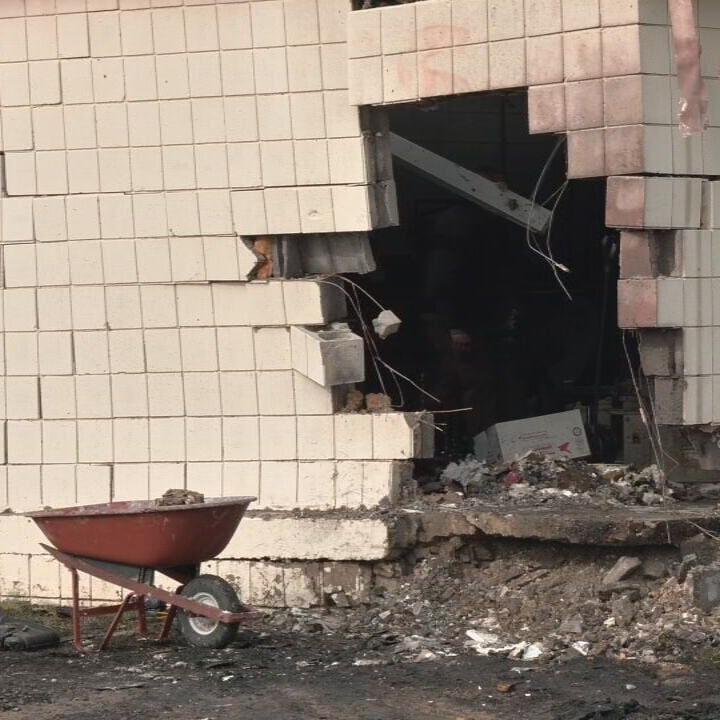 Woman dead after vehicle crashes into business near Outer Loop in Louisville